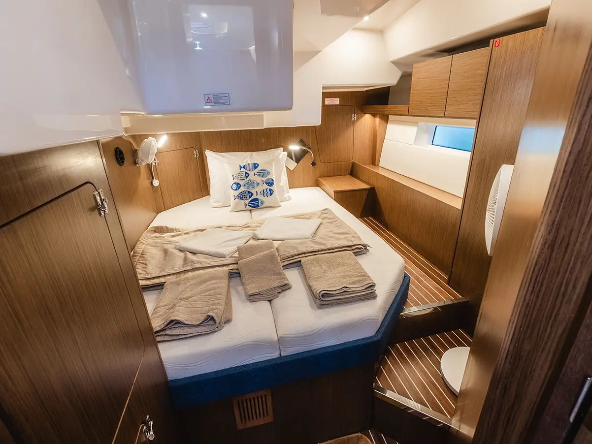 A double cabin aboard Azure, where battery-powered air conditioning supports quiet nights at anchor.