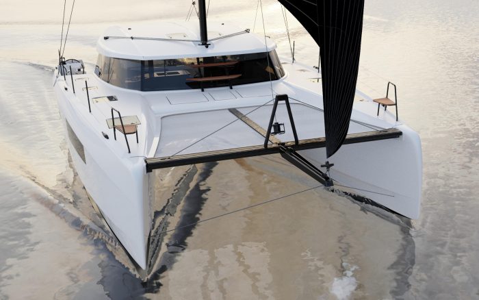 A modern white Nautitech 41 catamaran sails smoothly on calm water, featuring a sleek design, black sails, and a spacious deck with wooden seating areas at the front.